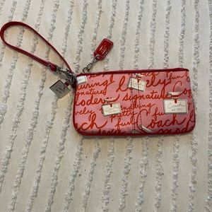 Coach wristlet limited edition with perfume bottle print